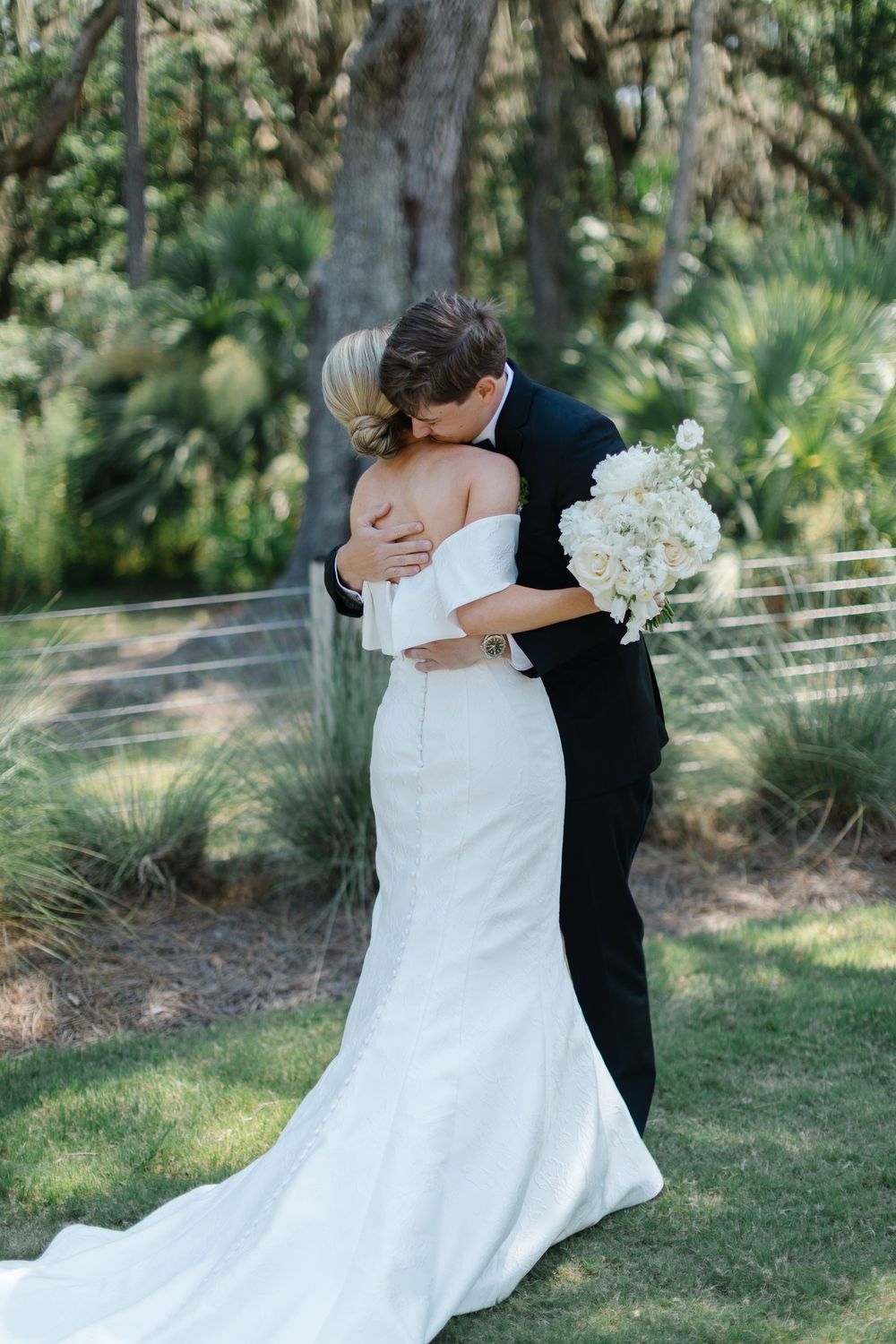 A wedding first look moment captured in a series of photos showing the couple meeting forbes farm st simons