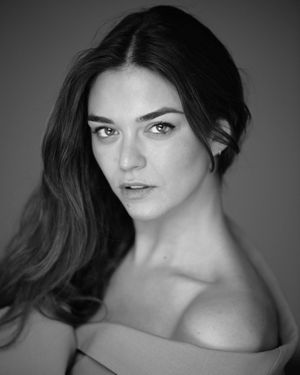 Dramatic black and white headshots with strong contrast and moody lighting.