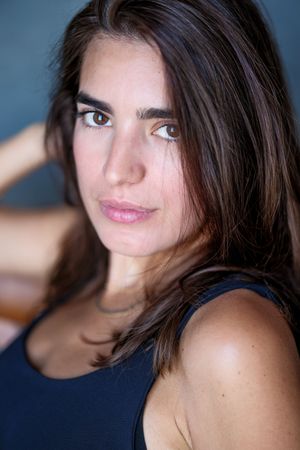 Close-up portrait series with dramatic lighting showcasing expressive looks.