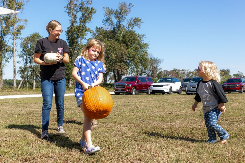 fall festival hosted by swansboro and Emerald Isle real estate agent on the crystal coast. family photography and event photography near me.