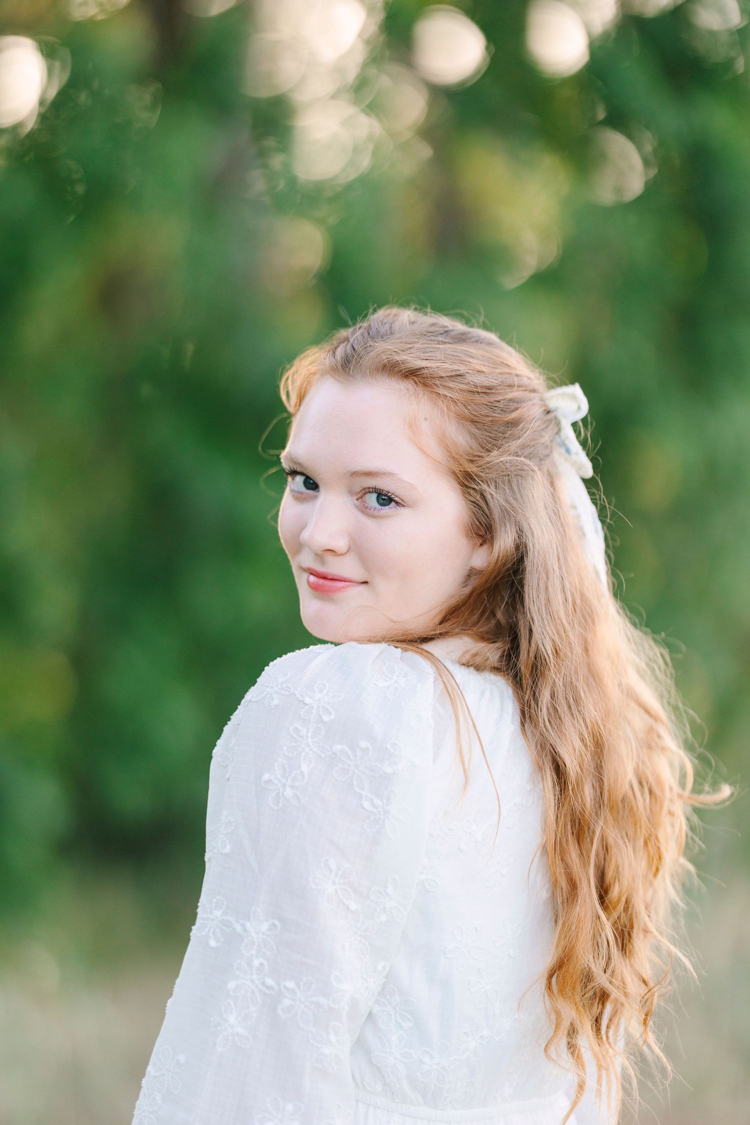 Artistic portrait sequence featuring soft bokeh and flowing white fabric.