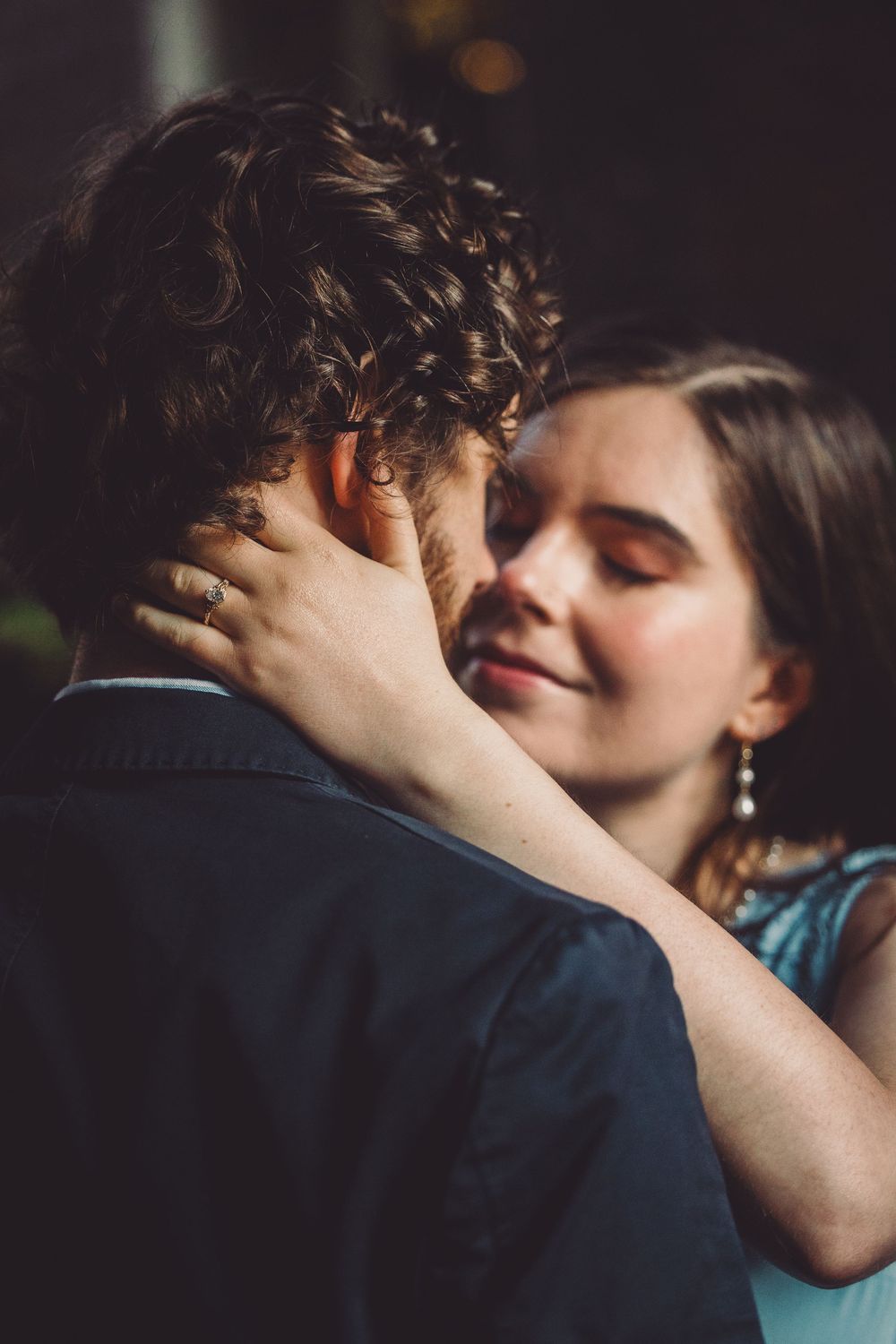 A romantic sequence of images showing a couple sharing an intimate kiss during their old town alexandria engagement photos