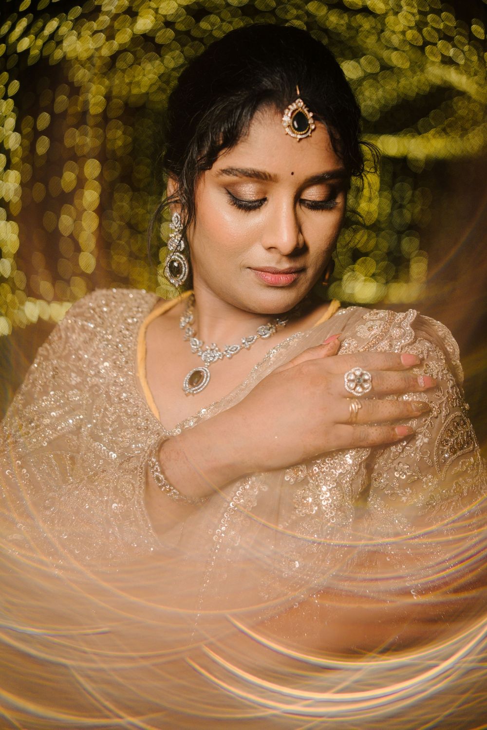 A sequence of elegant bridal portraits showing sparkling jewelry and soft peach-colored fabric in golden bokeh lighting.