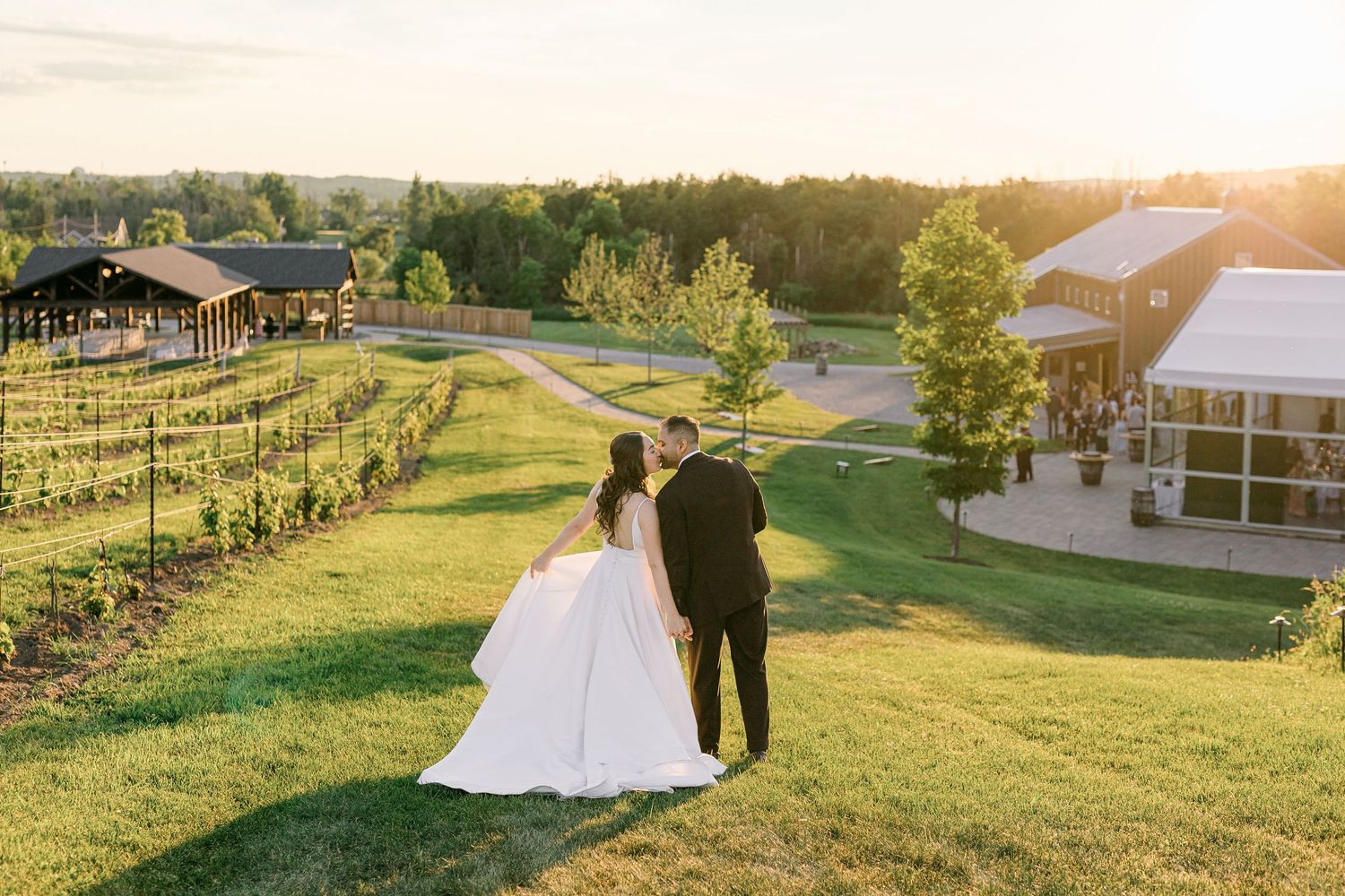 A couple shares a joyful candid moment together during their outdoor wedding photoshoot.