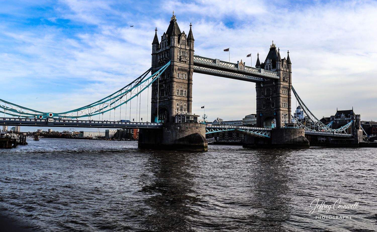 Progressive panorama of London's Tower Bridge spanning across the Thames River.