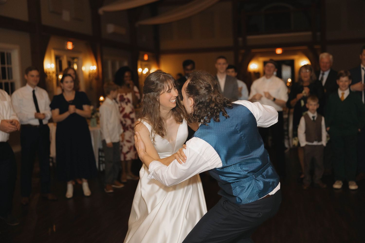 Couples dancing together at an elegant evening reception in formal attire.