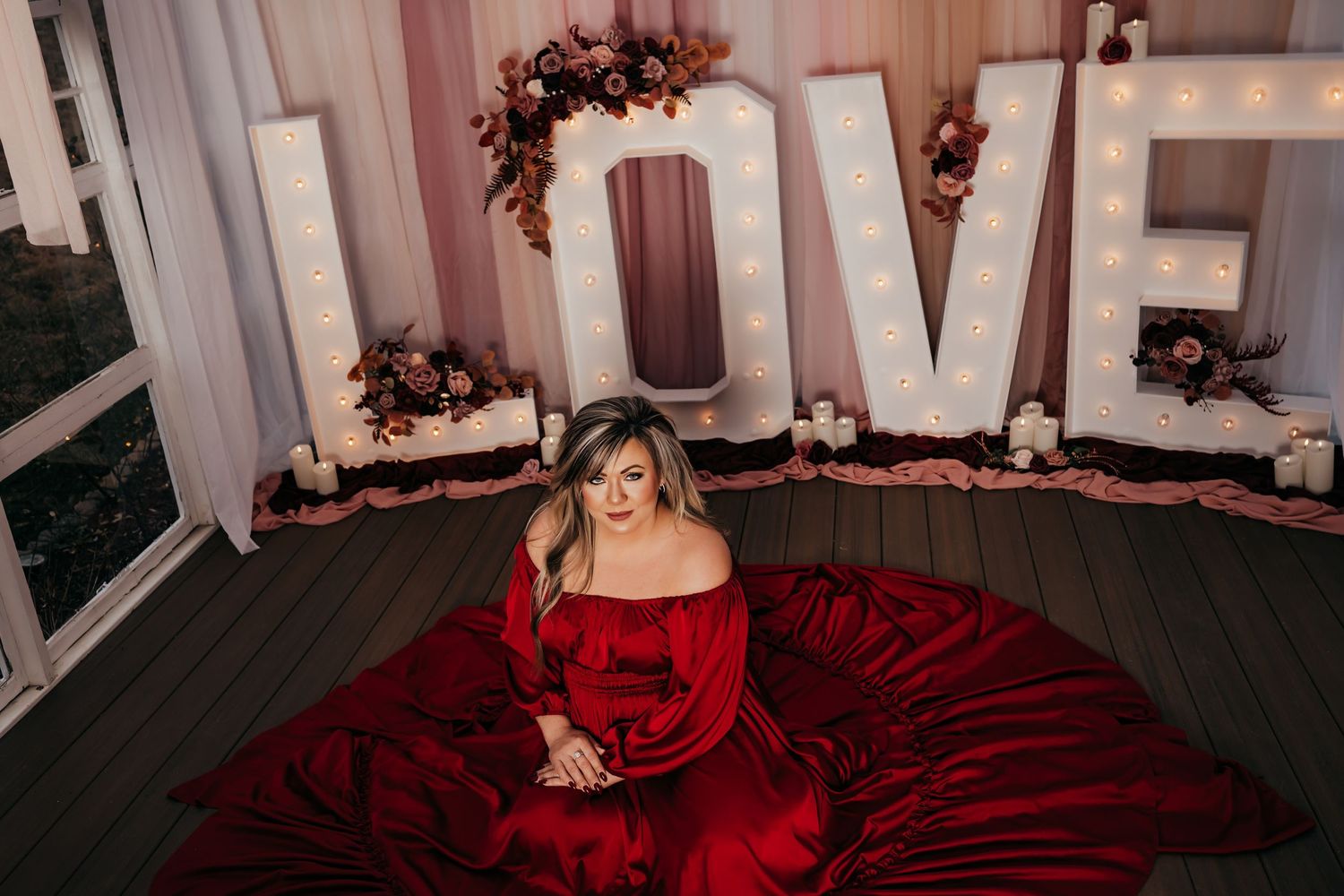 Love Valentine's set in The Greenhouse, Kingsport. Woman wearing red dress.