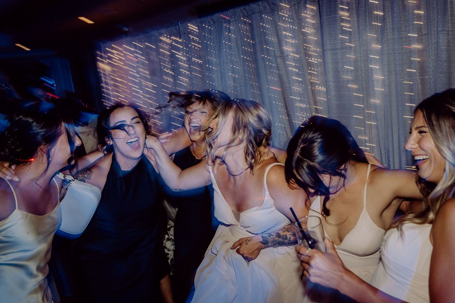 A sequence of five dimly lit party photos showing people dancing and socializing at a nightclub.