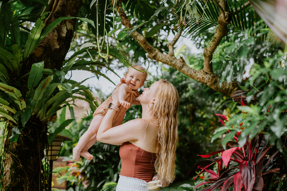 Lifestyle family photoshoot at Adiwana Suweta Bali with lush tropical surroundings.