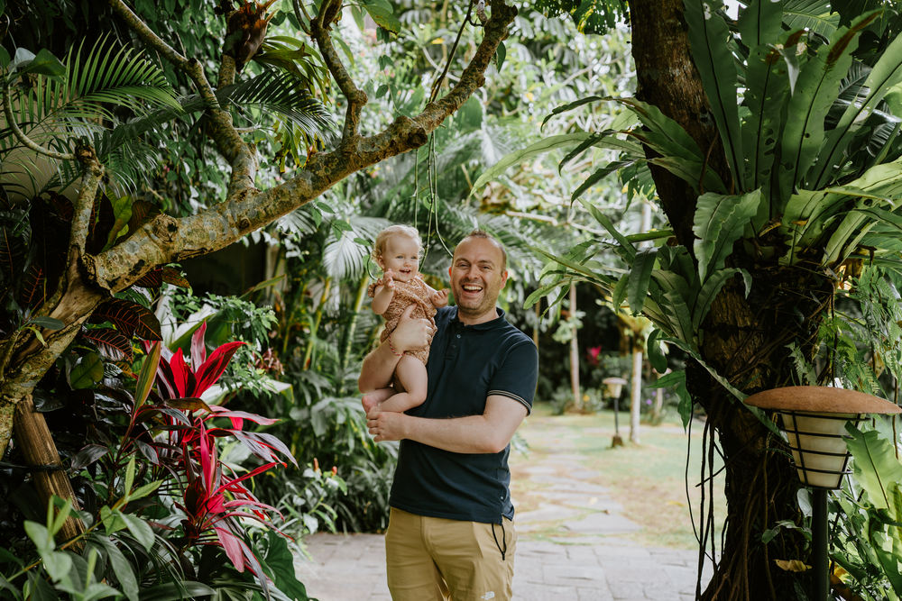 Lifestyle family photoshoot at Adiwana Suweta Bali with lush tropical surroundings.