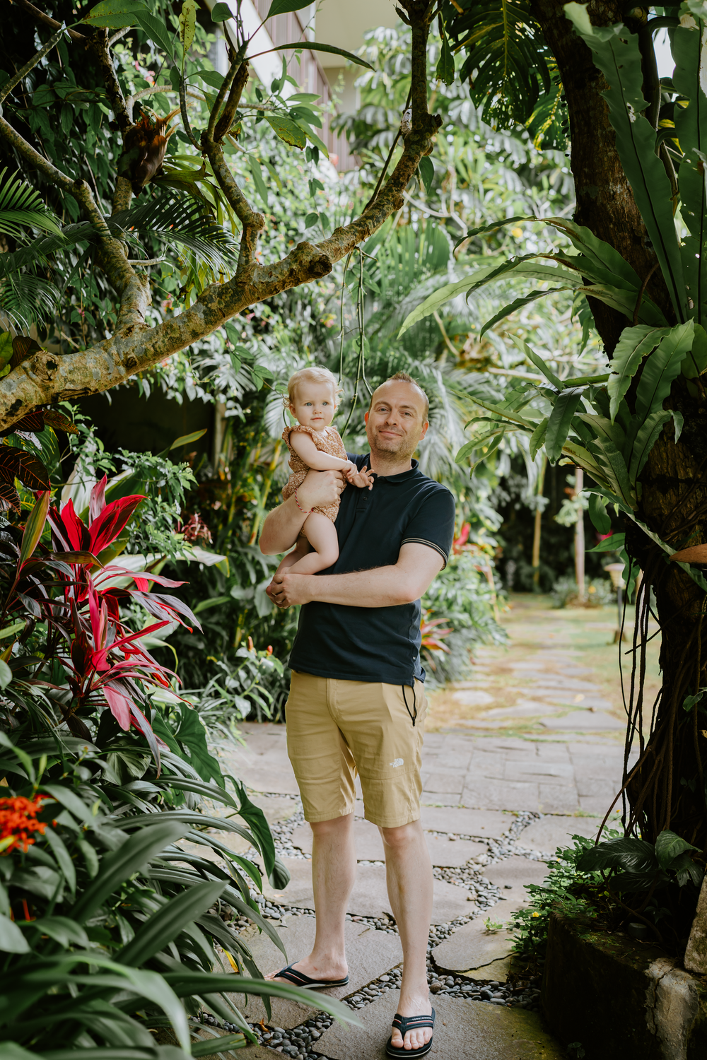 Lifestyle family photoshoot at Adiwana Suweta Bali with lush tropical surroundings.