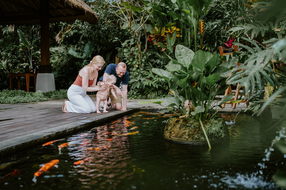 Lifestyle family photoshoot at Adiwana Suweta Bali with lush tropical surroundings.