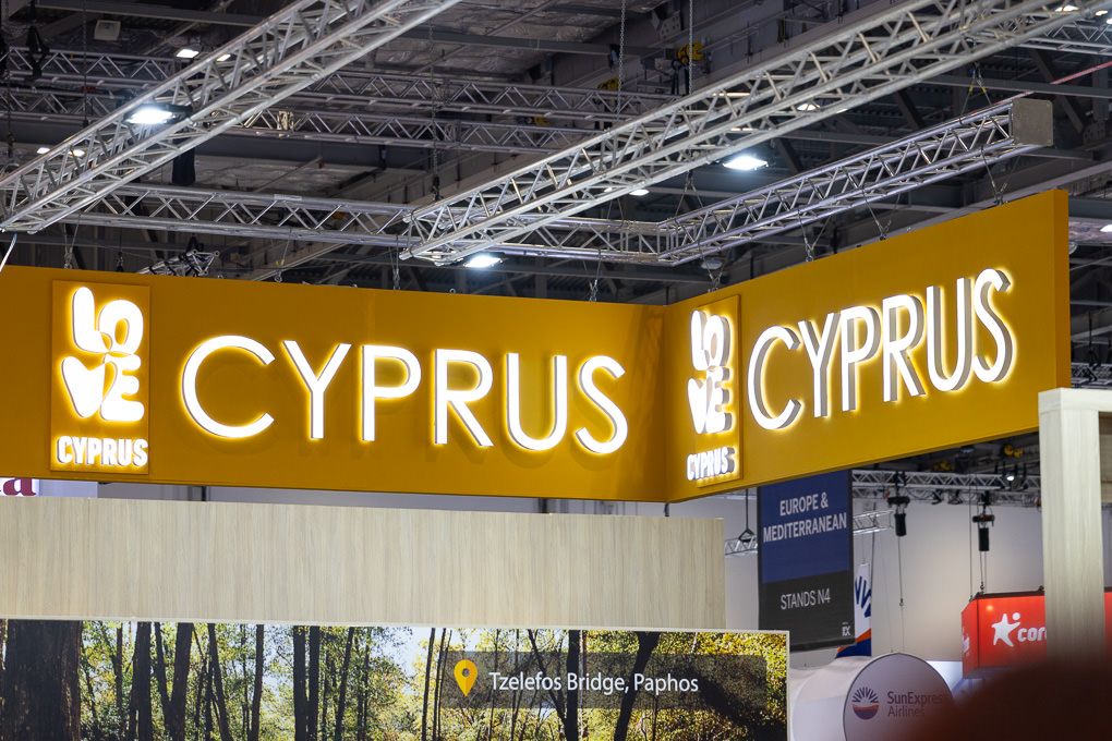 WTM exhibition booth displaying Cyprus tourism branding with illuminated signage.