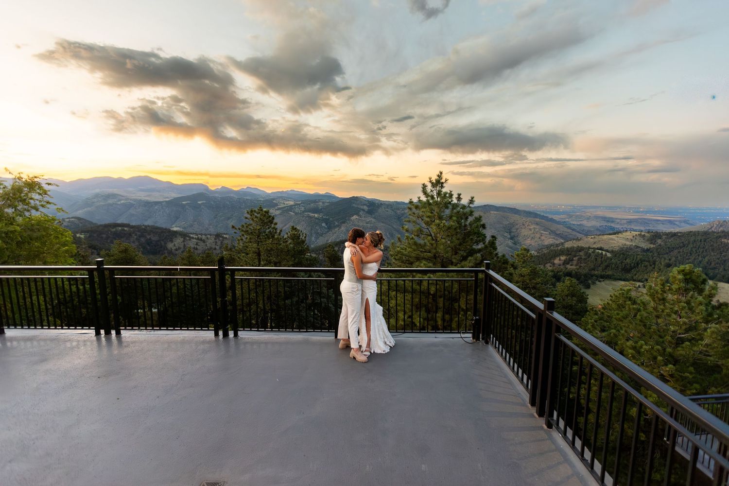Mountain vista view from observation deck during dramatic sunset.