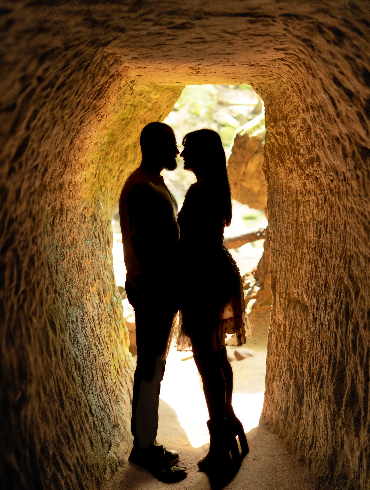 Silhouettes of engaged couple posing
