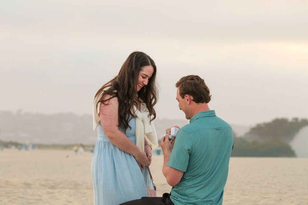 Romantic sunset beach proposal with couple facing each other photographed by Zeus Holbrook Wedding Photographer