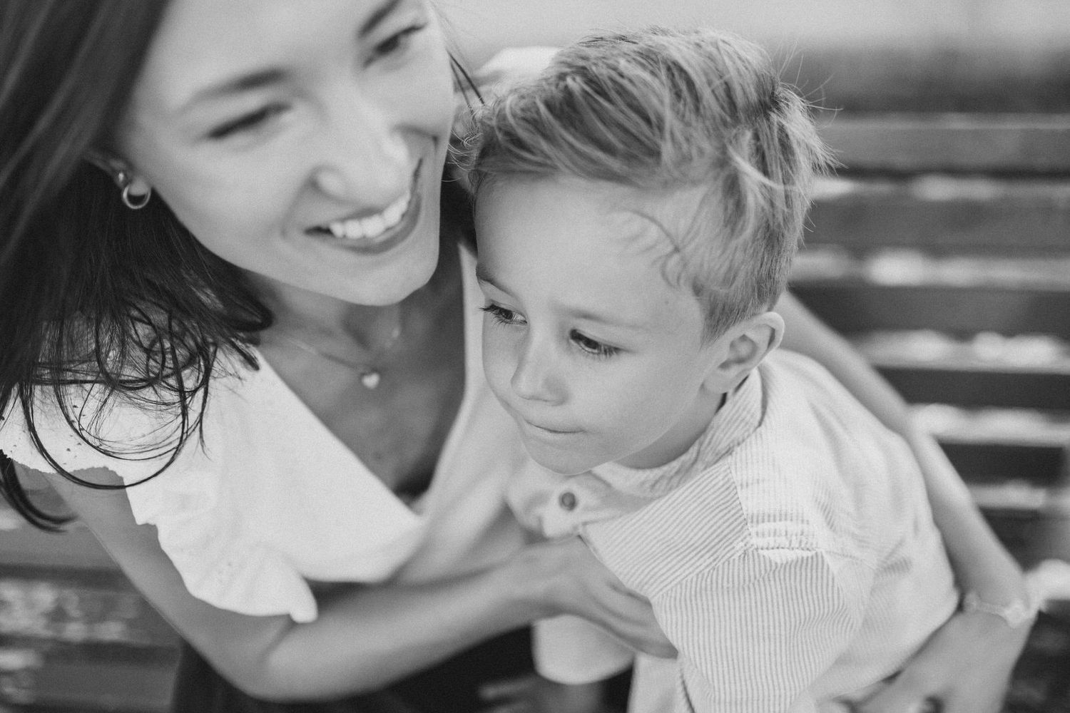 A black and white candid moment of joy and connection.