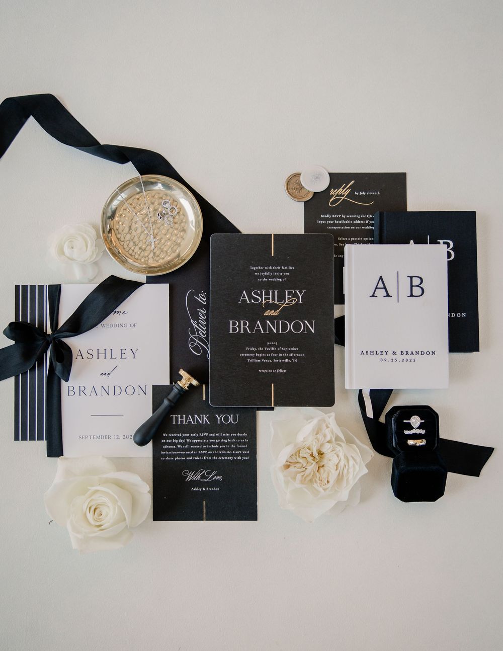 Elegant black and white wedding stationery suite for Ashley and Brandon with gold accents and roses.