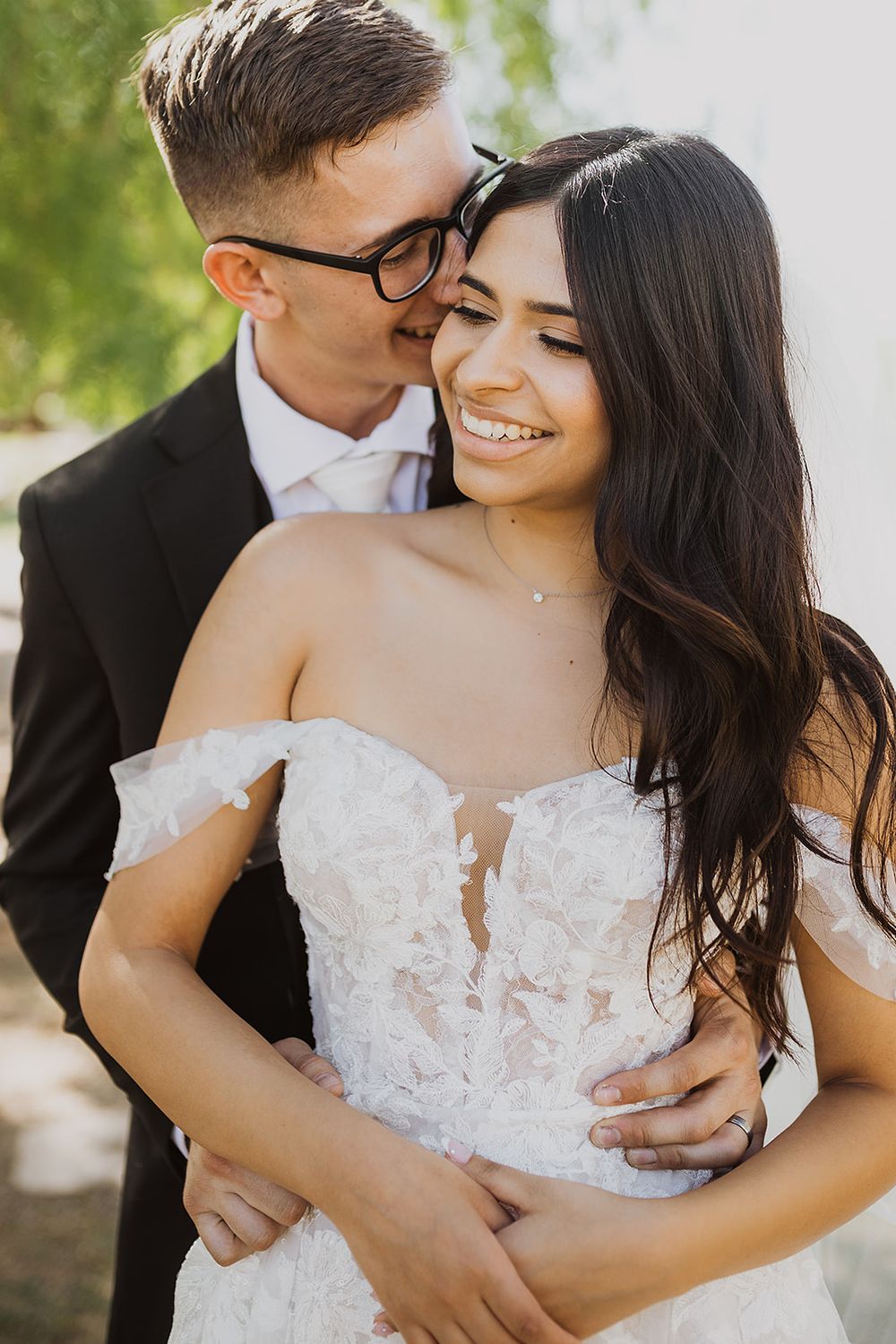 Intimate wedding portraits showing tender moments between newlyweds in natural lighting.
