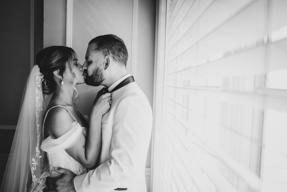 Wedding at Stewart Manor Country Club, Long Island, by Deja Vu Studios, with an elegant bride and groom portrait, Black and white