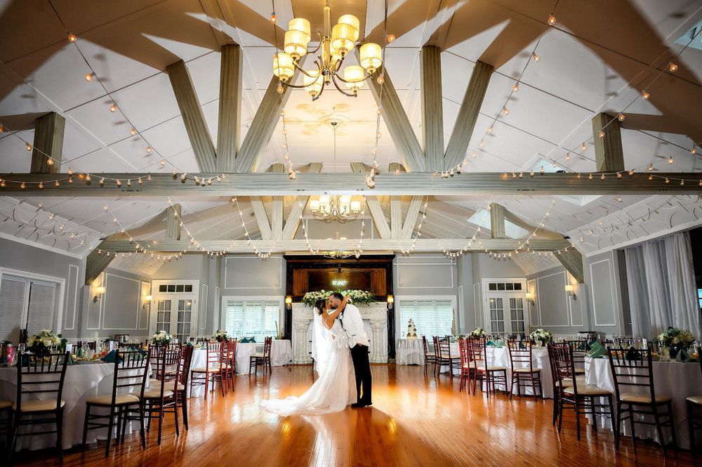Wedding at Stewart Manor Country Club, Long Island, by Deja Vu Studios, with an elegant bride and groom room shot