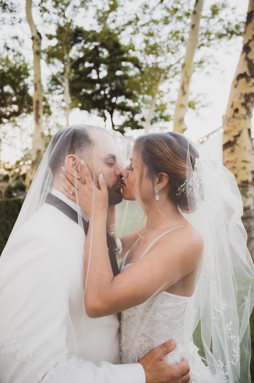 Wedding at Stewart Manor Country Club, Long Island, by Deja Vu Studios, with an elegant bride and groom portrait with veil