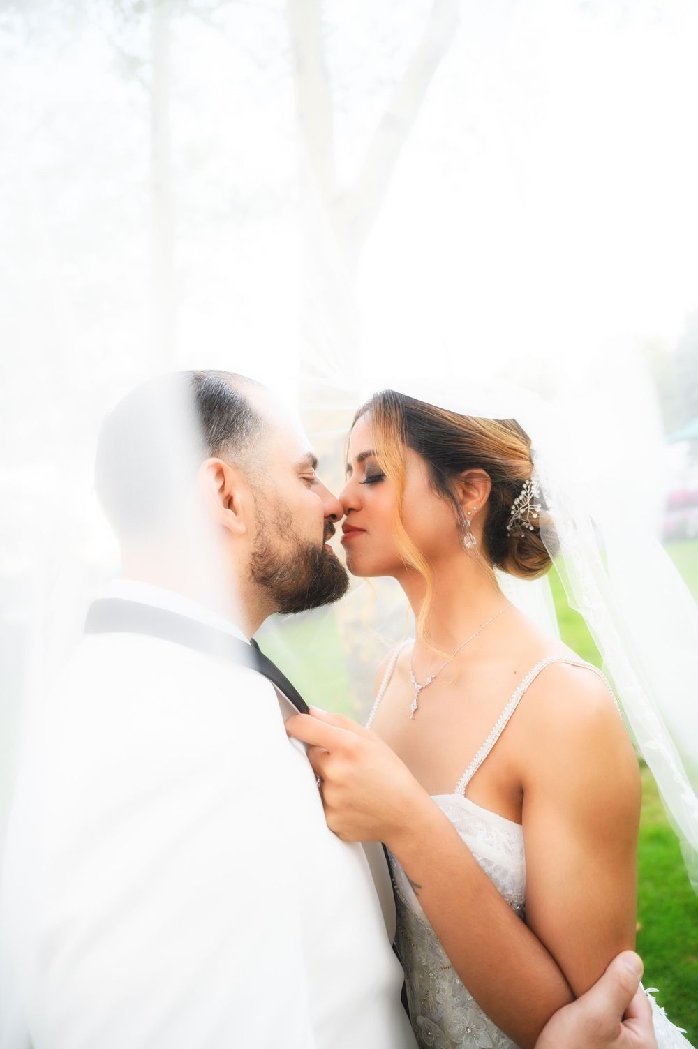 Wedding at Stewart Manor Country Club, Long Island, by Deja Vu Studios, with an elegant bride and groom portrait