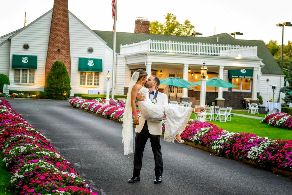 Wedding at Stewart Manor Country Club, Long Island, by Deja Vu Studios, with an elegant bride and groom portrait