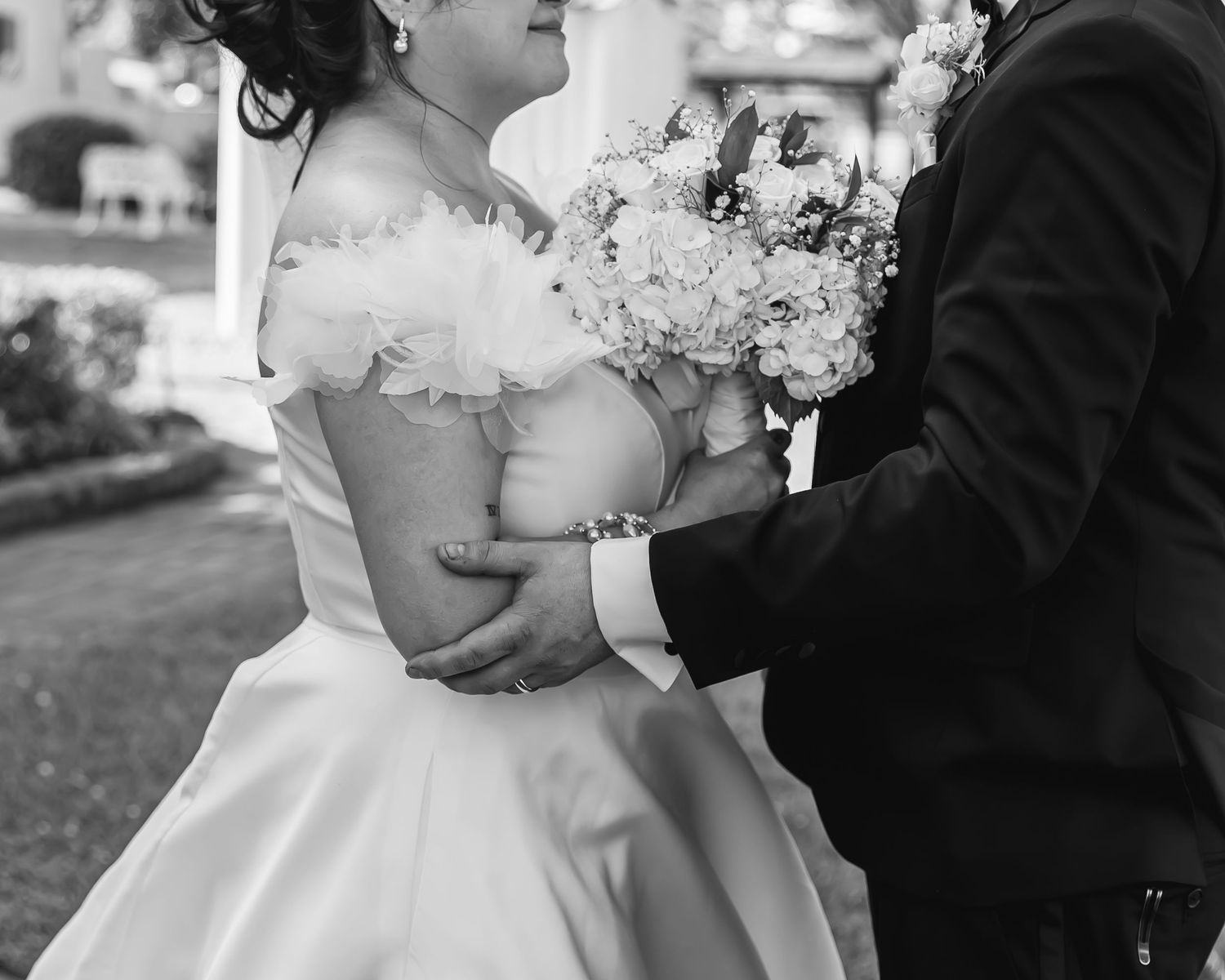 Black and white photo collage showing romantic wedding moments with couples sharing kisses and tender embraces.