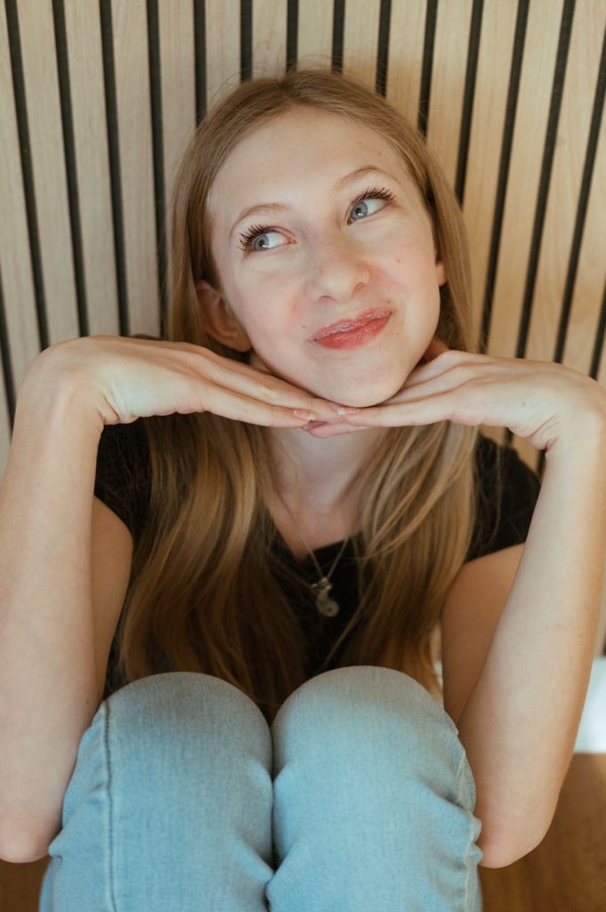 A playful series of expressions shown in a four-panel photo sequence against a striped background.