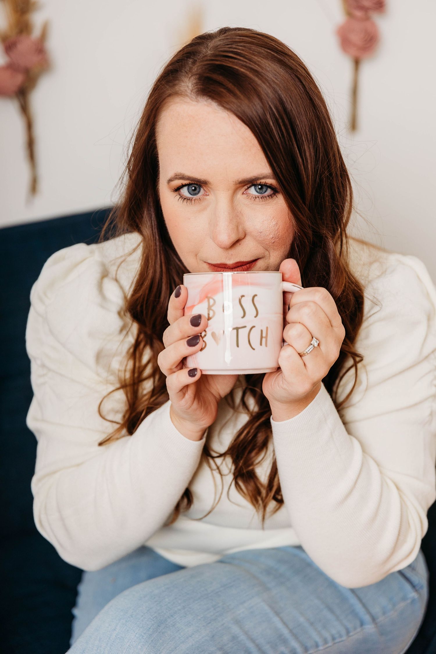 Person in white sweater and jeans holding paper notes with different expressions in a photo series.