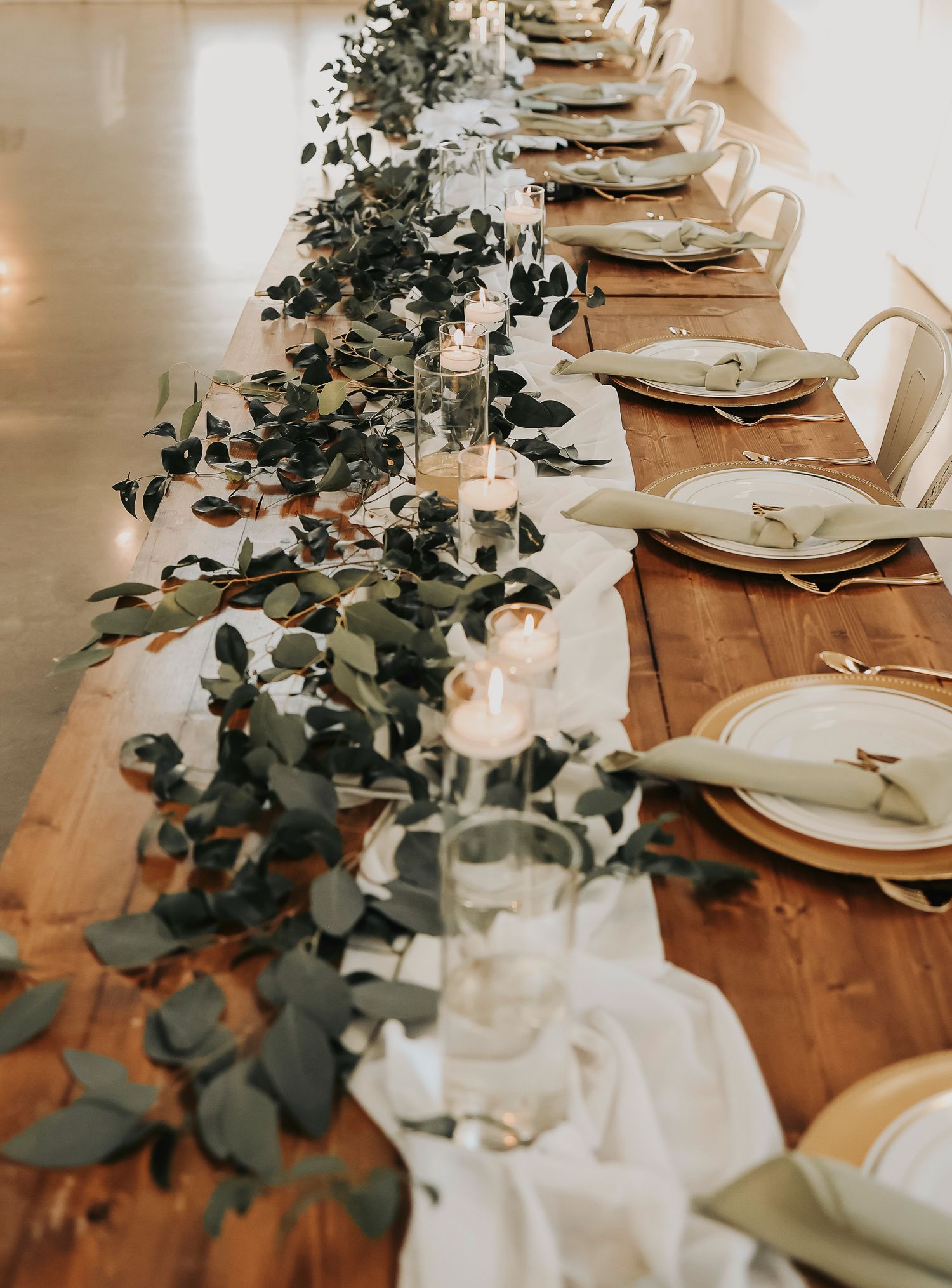 Wedding reception inside white barn at The Barn at Paradise