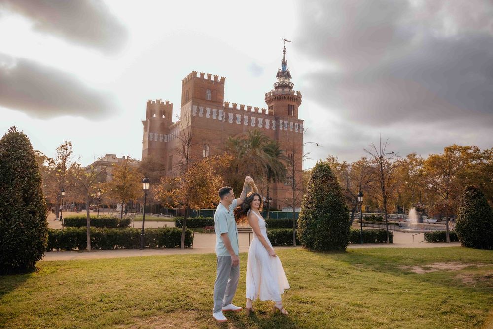 Soft sunlight filtering through the leaves on the couple's faces.