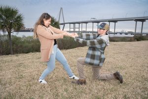 A series of photos showing someone sitting on a blanket in a grassy field with the Arthur Ravenel Bridge in the background.