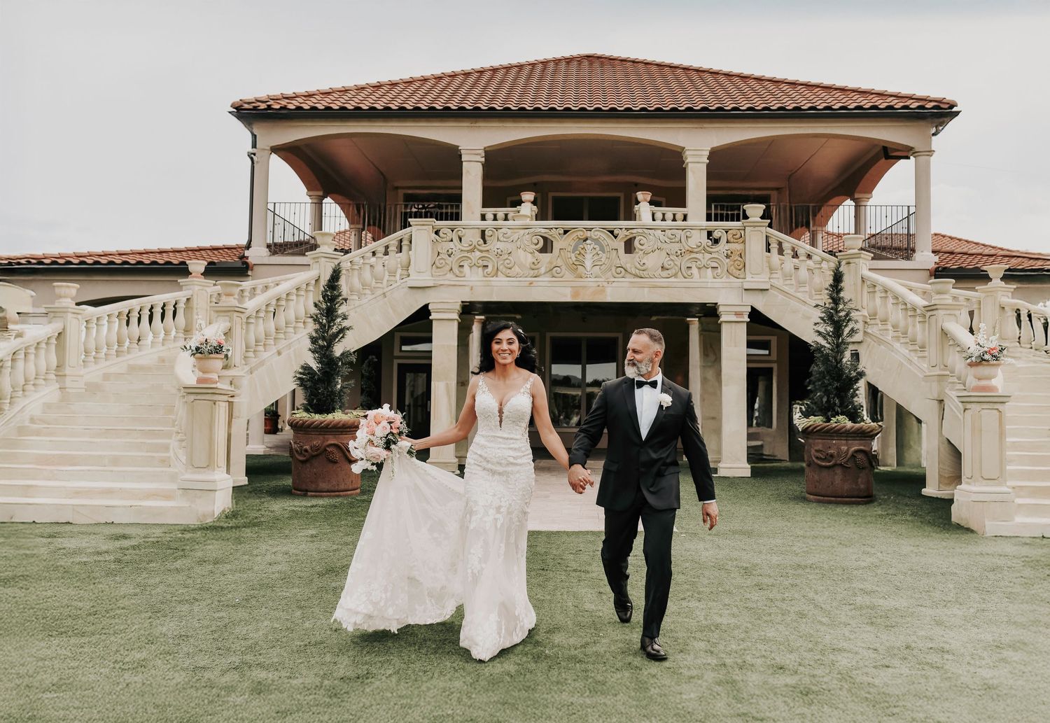 Bride and groom laughing during candid vineyard portraits
