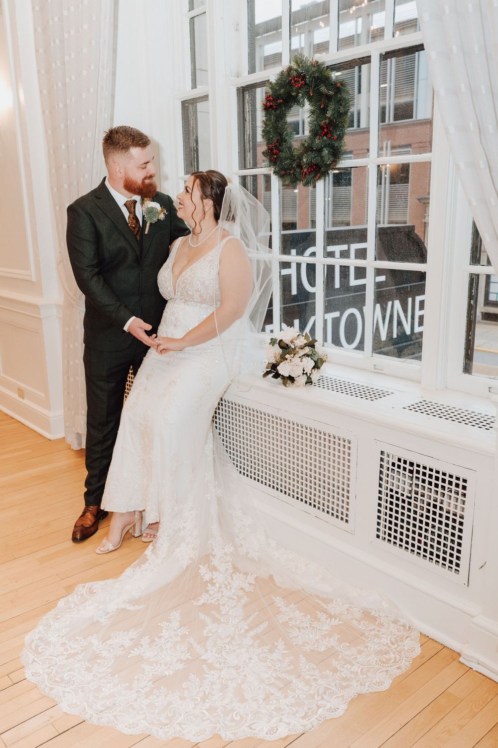 Portrait of Bride and Groom inside East ballroom at the Yorktowne Hotel in York PA before their elegant winter wedding ceremony.