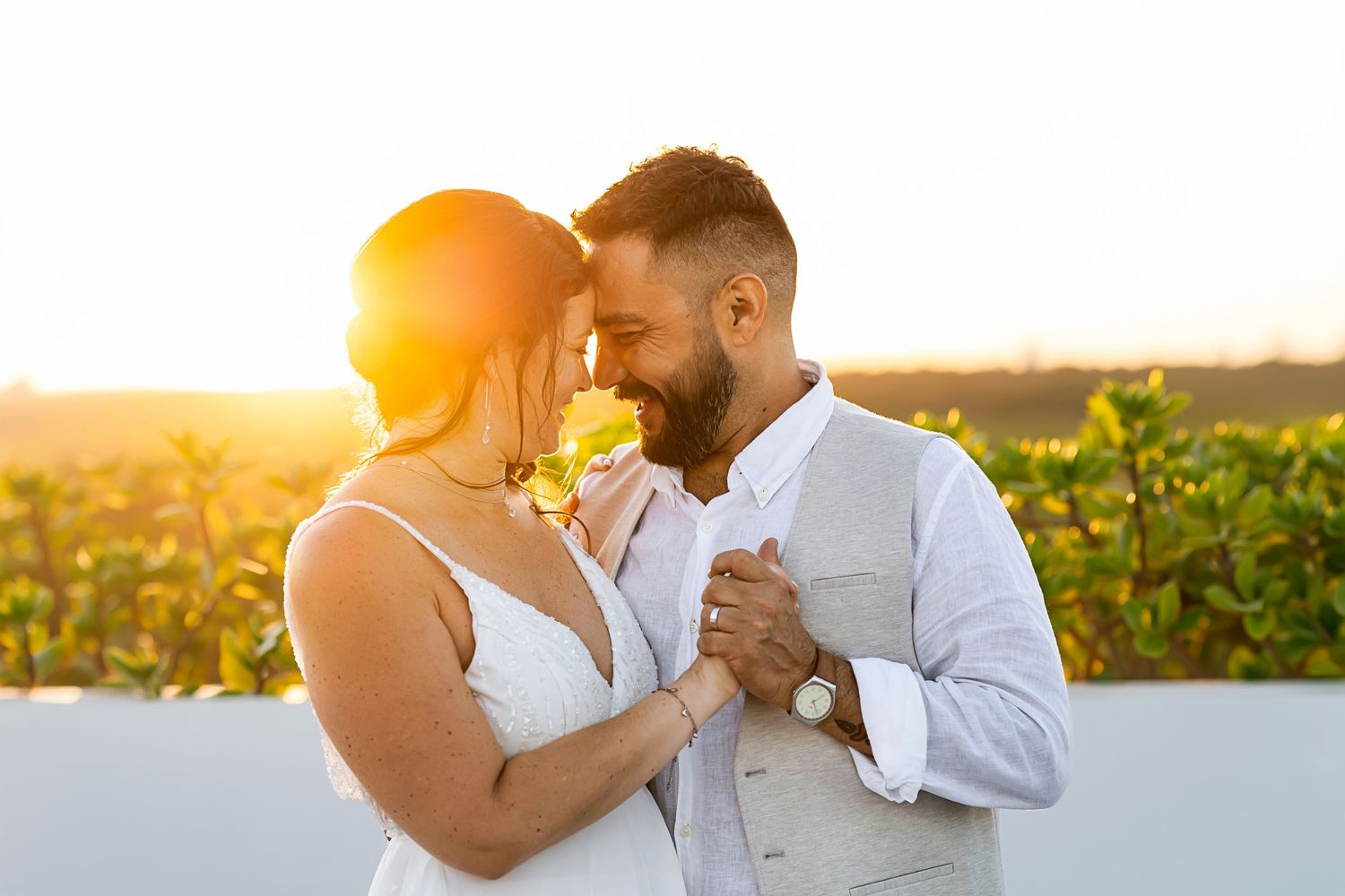Bride and groom embracing at Majestic Elegance Costa Mujeres wedding in Riviera Maya.