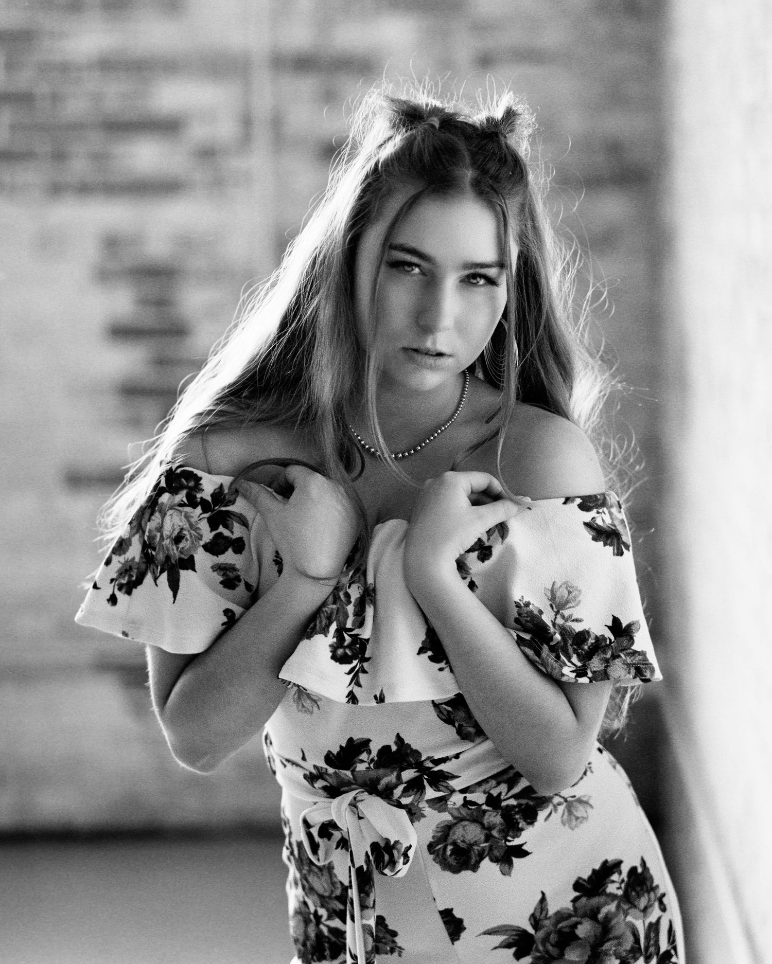 David G Holt Photography - Black and white portrait series in floral dress with natural window lighting.