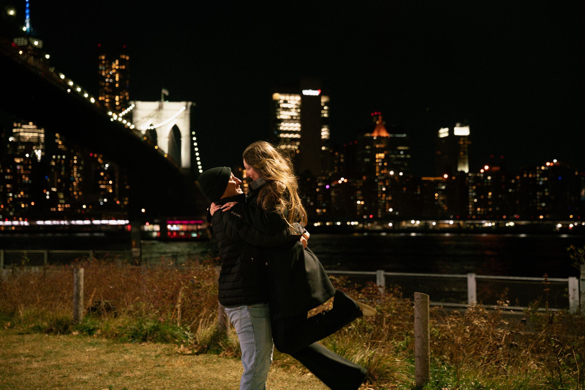 A nighttime celebration against the illuminated New York City skyline.