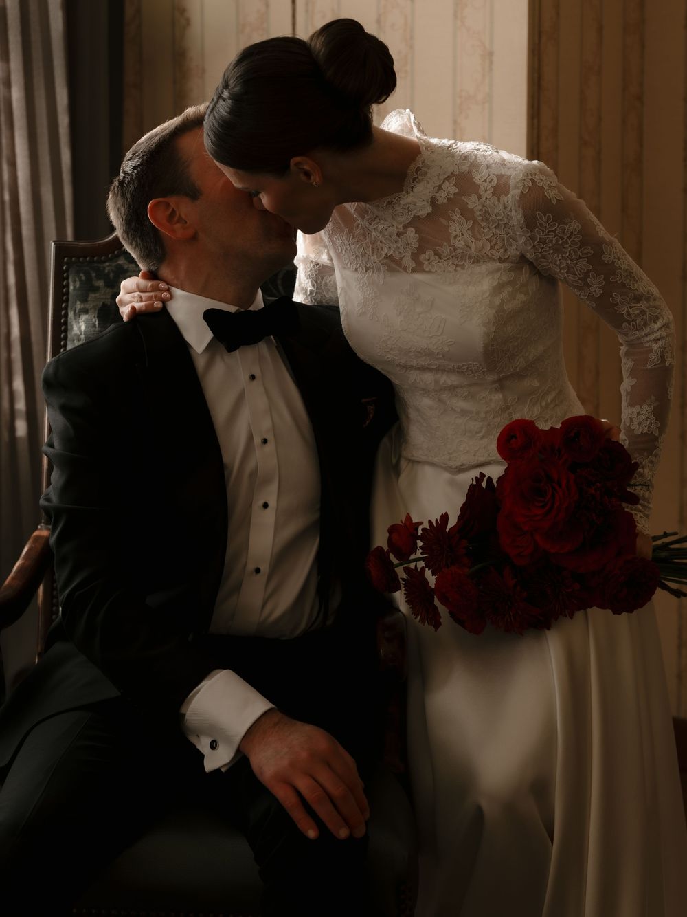 Romantic wedding couple in formal attire share intimate moments in a series of elegant indoor photographs.