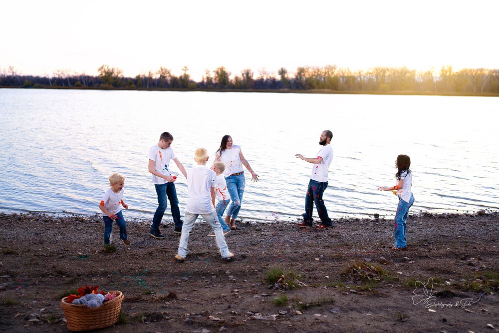 Beach family photoshoot with matching outfits during golden hour in Williston, North Dakota.