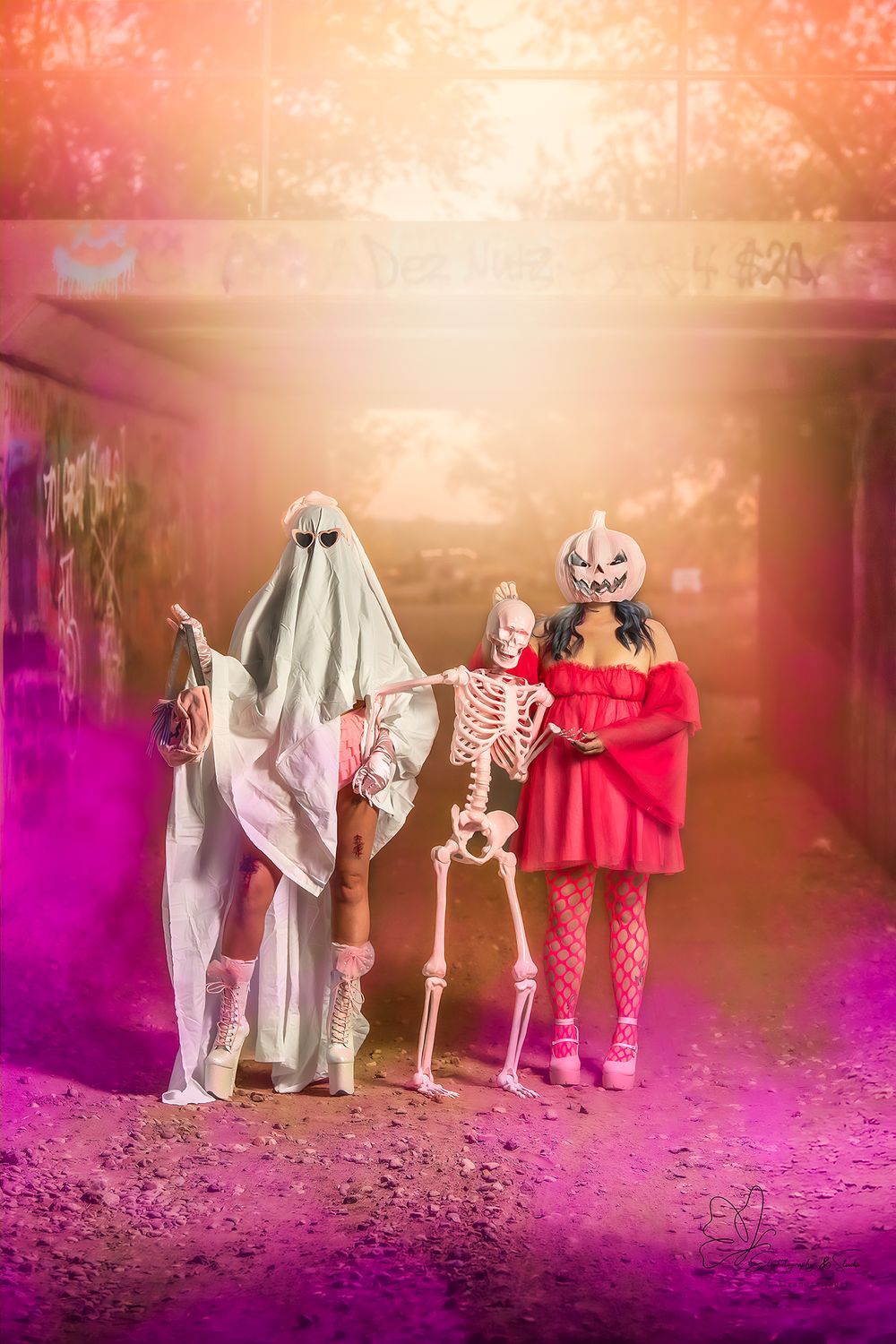 Halloween decorations with skeletons and costumes arranged in spooky lighting in Williston, North Dakota.