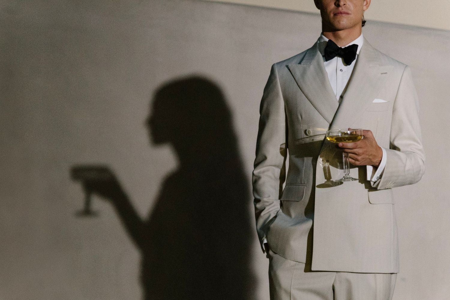 A series showing formal white tuxedo attire against a neutral background.