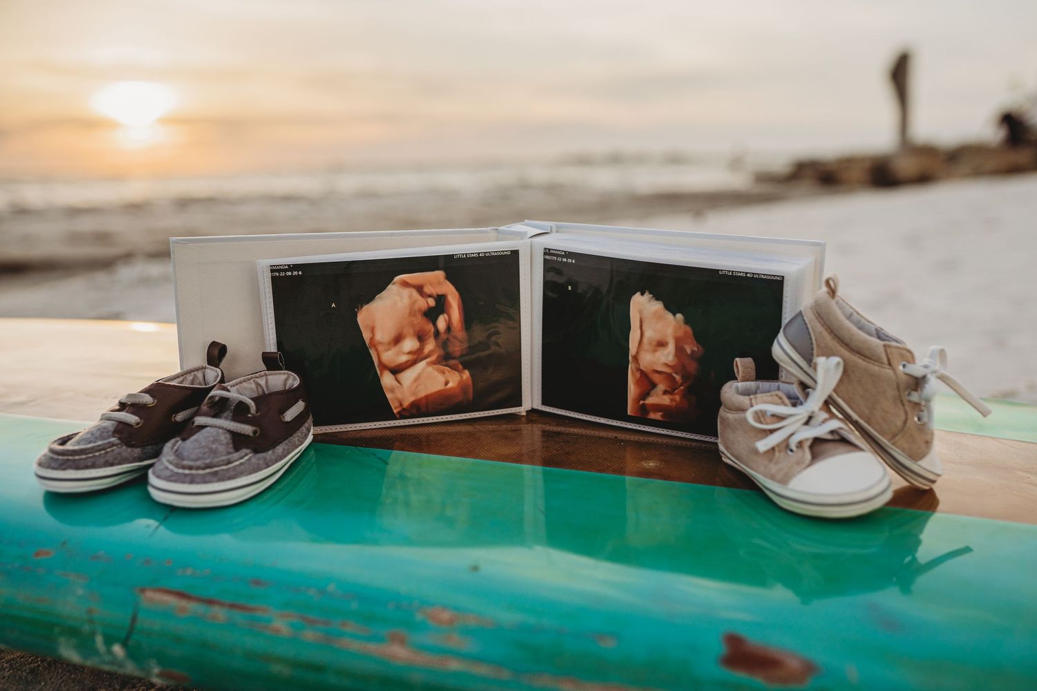 A pair of brown boat shoes rests on a turquoise surface with a soft focus background.