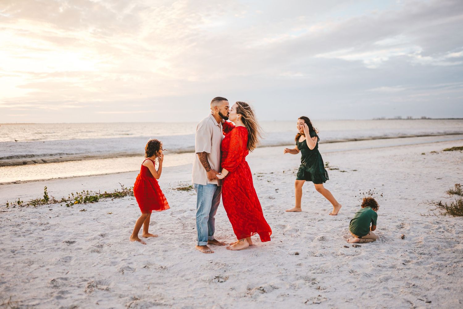 A series of candid beach photos showing people enjoying a sunset walk along the sandy shoreline.