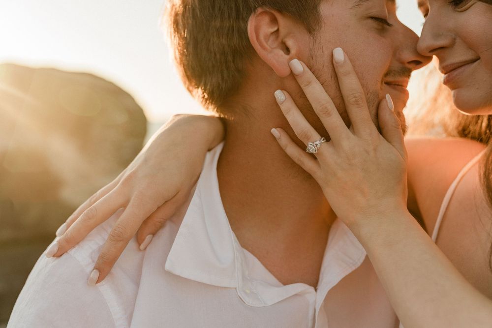 Close-up shots of a couple sharing intimate moments in warm sunlight.