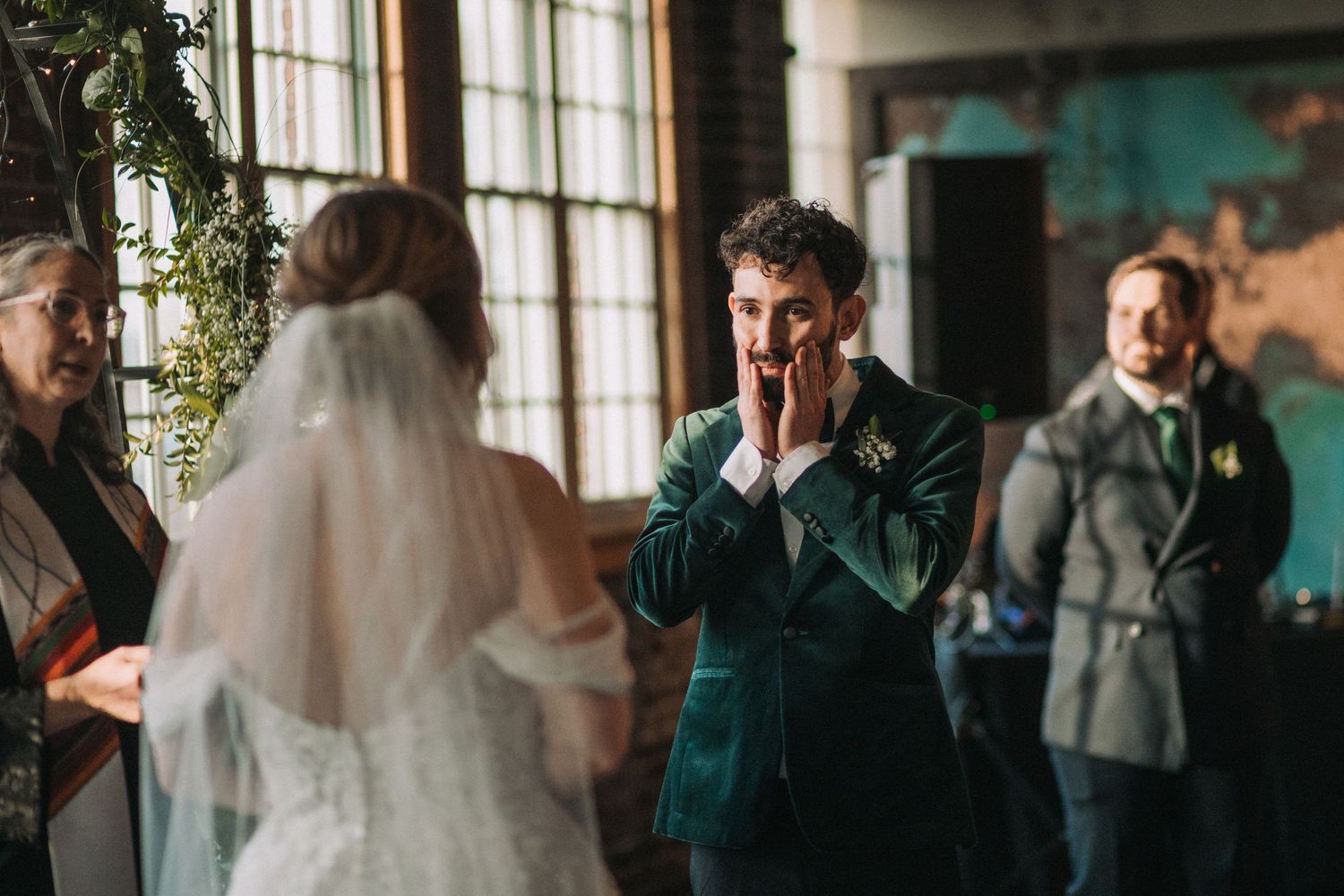 A sequence of candid wedding moments showing guests and a couple in a rustic indoor venue.