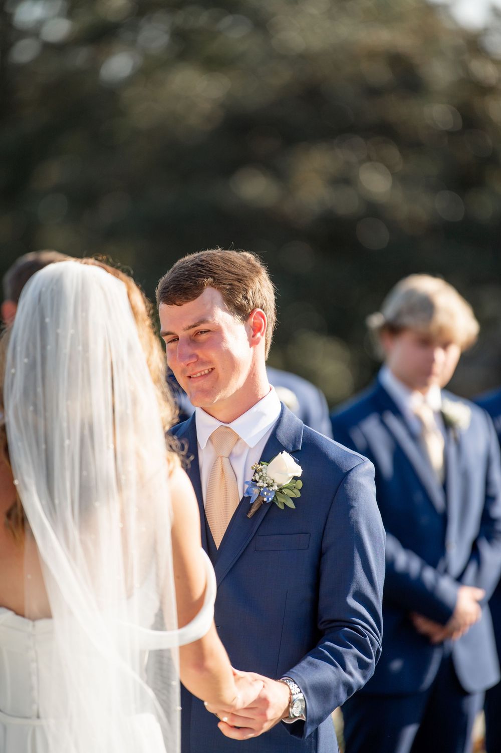 Emotional wedding ceremony moment captured in a series of candid shots outdoors.
