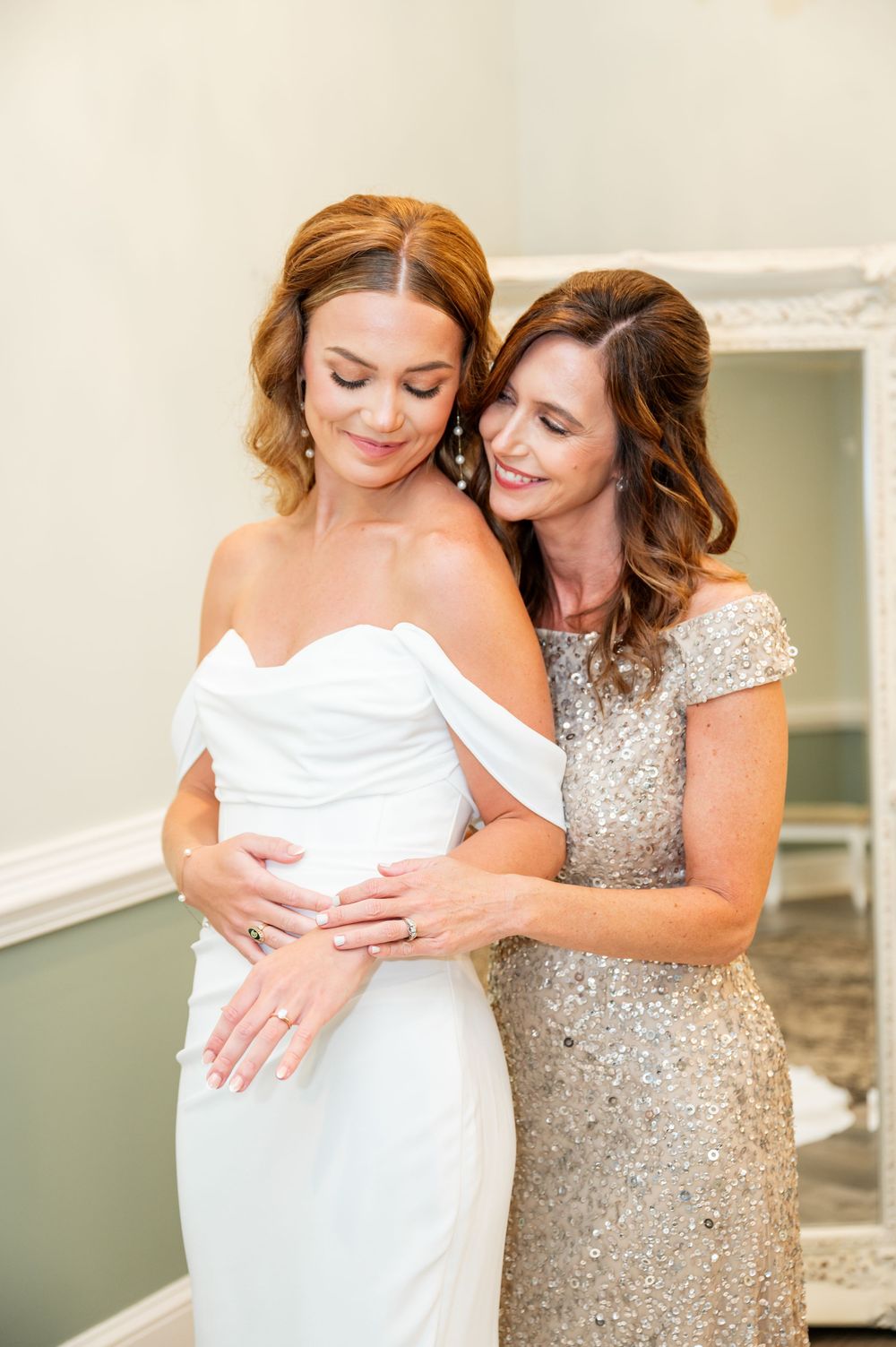 Tender moments captured between two people in white and sequined dresses.