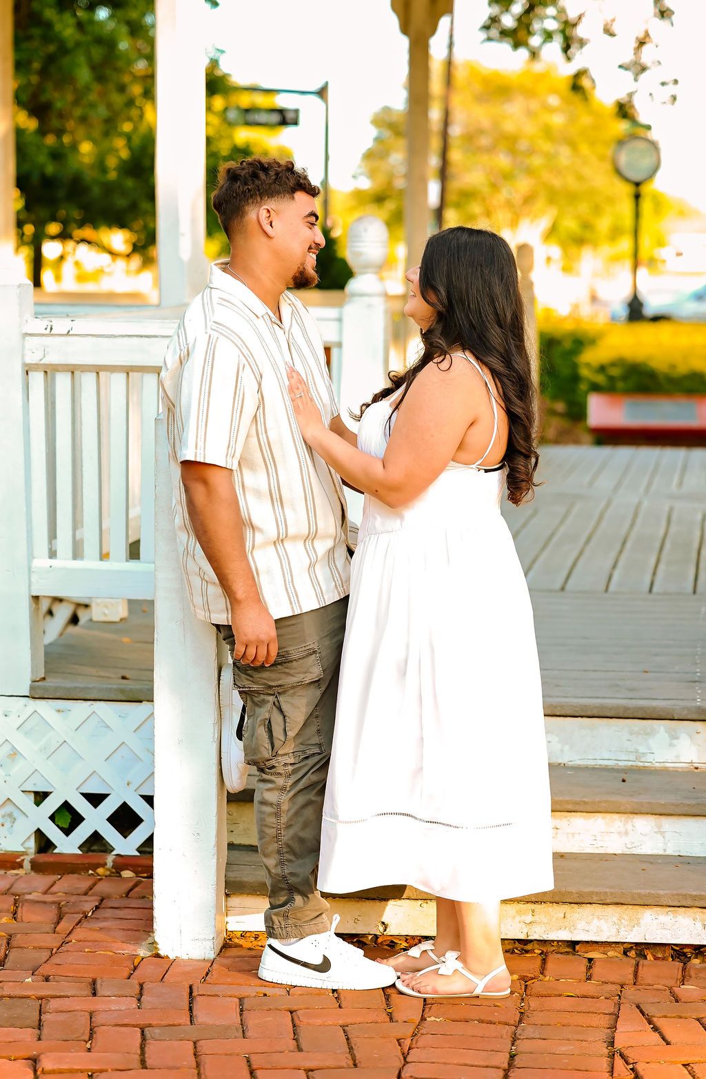 Woman has hands on mans chest during engagement session